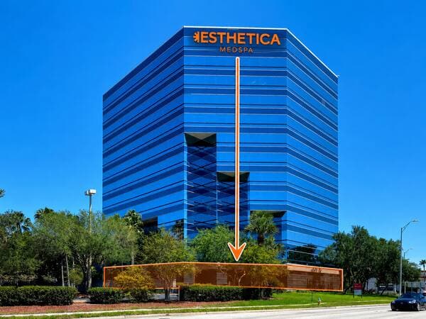 The Esthetica MedSpa tower with the ground-floor clinic space highlighted at its base