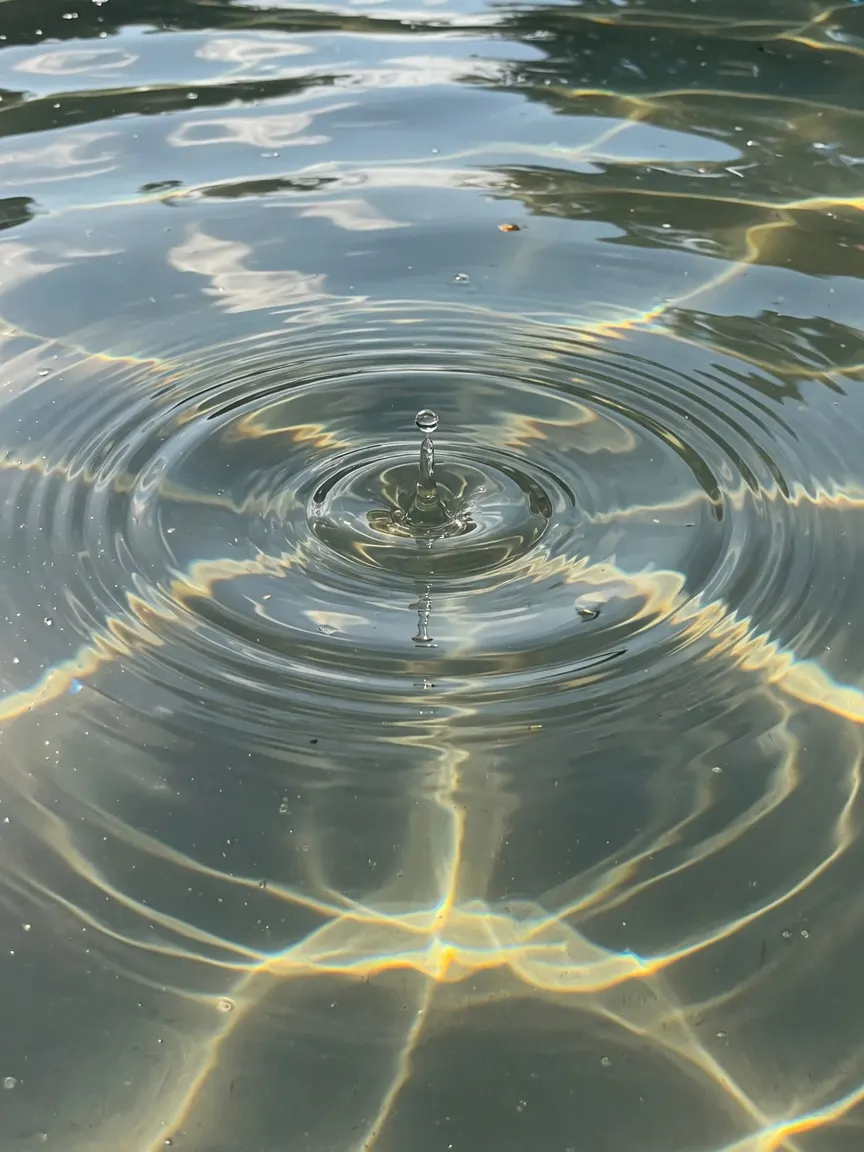 A soft beam of warm light across smooth polished stone
