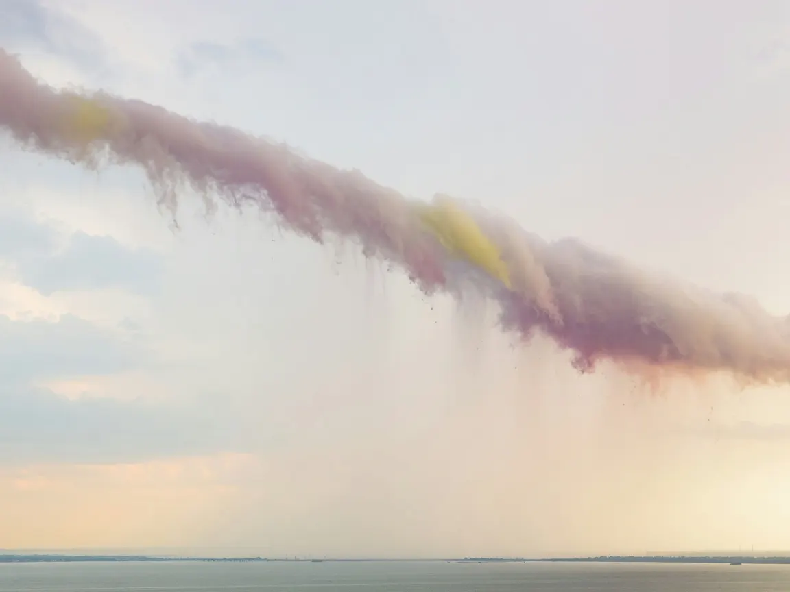 A lone frayed veil of incoming storm cloud hangs low over Tampa Bay, its bruised edge bleeding faint rain light into humid haze, vast empty sky bruised by subtropical urgency